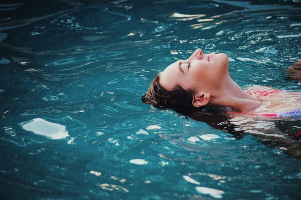 a woman relaxing in a pool