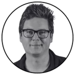 Black and white circular headshot of Biz Stone wearing glasses.