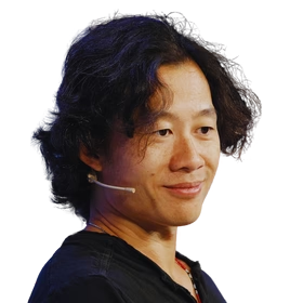 Justin Kan; headshot of a man wearing a lapel microphone headset and a dark shirt, smiling against a transparent background